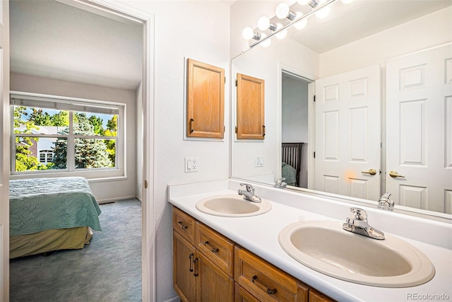 1010 Home Farm Cir, Denver, CO 80234 - ensuite bathroom featuring double vanity and baseboards