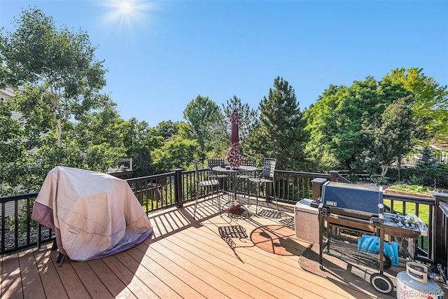1010 Home Farm Cir, Denver, CO 80234 - wooden terrace with grilling area and view of scattered trees