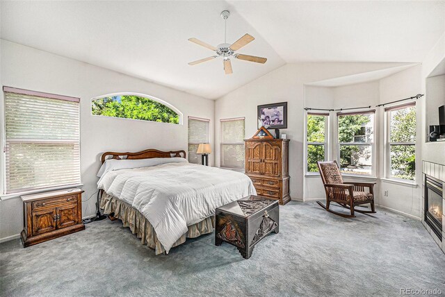 1010 Home Farm Cir, Denver, CO 80234 - bedroom featuring vaulted ceiling, multiple windows, carpet flooring, and a ceiling fan