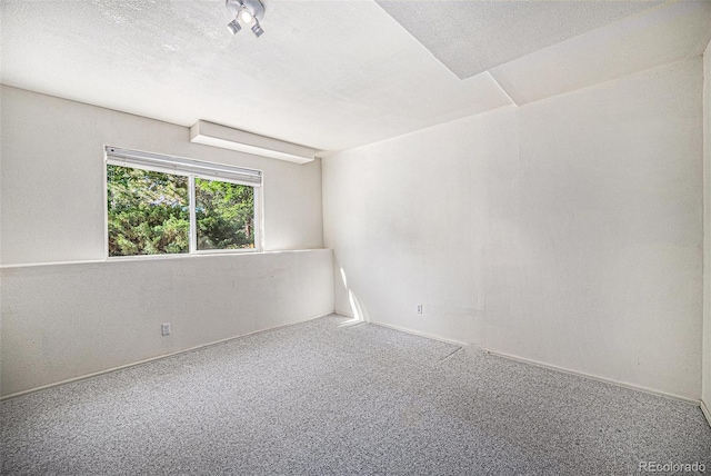 1010 Home Farm Cir, Denver, CO 80234 - carpeted spare room featuring a textured ceiling