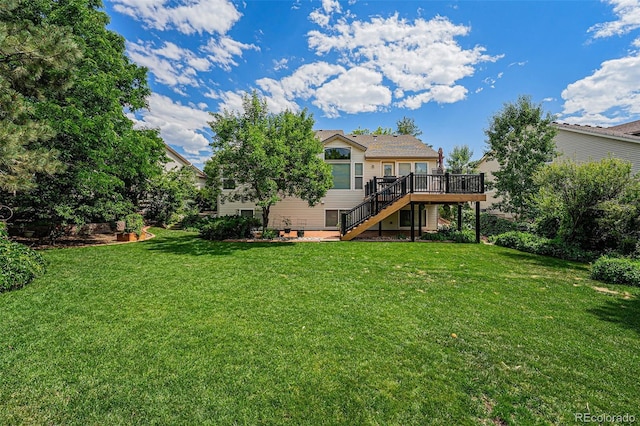 1010 Home Farm Cir, Denver, CO 80234 - back of house with stairs, a deck, and a yard