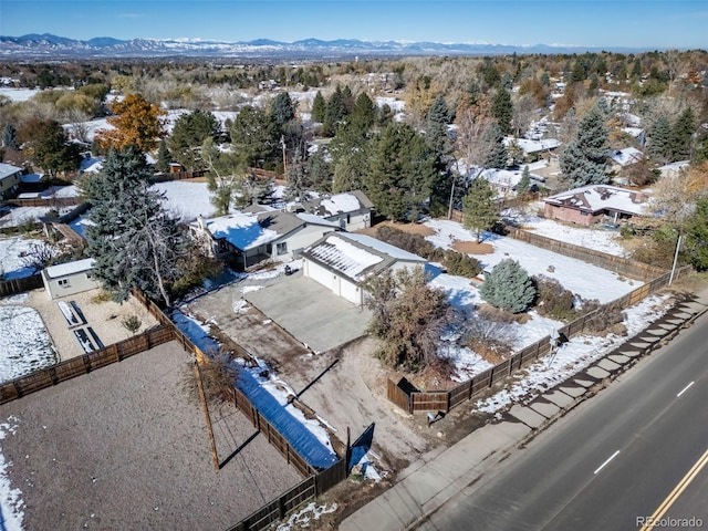 snowy aerial view featuring a mountain view