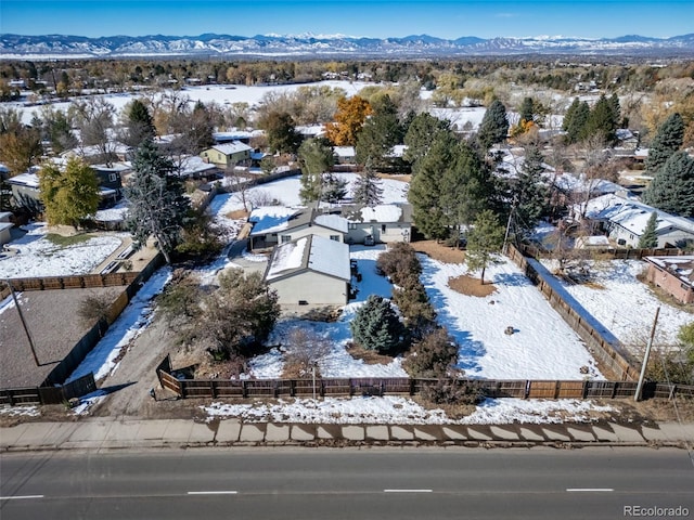 snowy aerial view featuring a mountain view