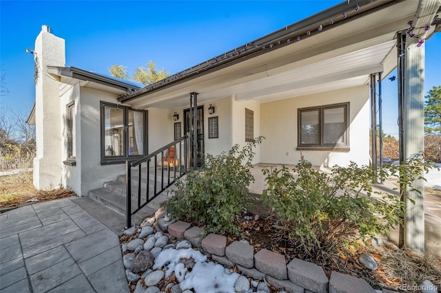 doorway to property featuring covered porch