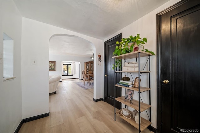 hallway with light wood-type flooring