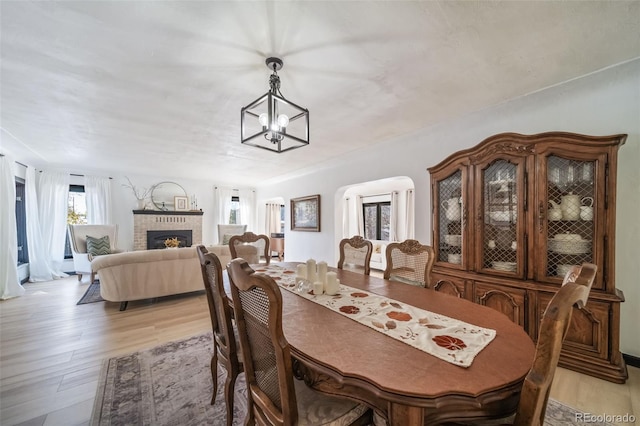 dining area with a chandelier and light wood-type flooring