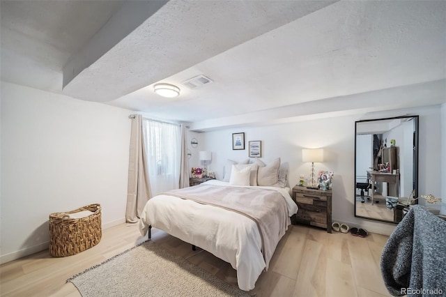 bedroom featuring light hardwood / wood-style floors