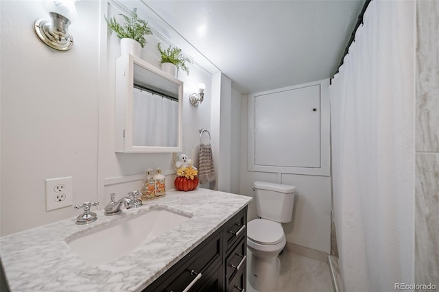 bathroom featuring vanity and toilet