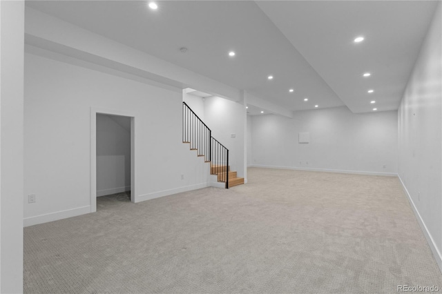 basement featuring light carpet