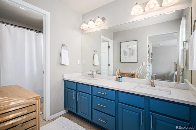 bathroom featuring vanity and tile patterned flooring