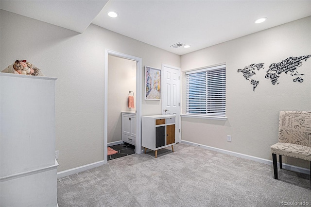 sitting room featuring carpet