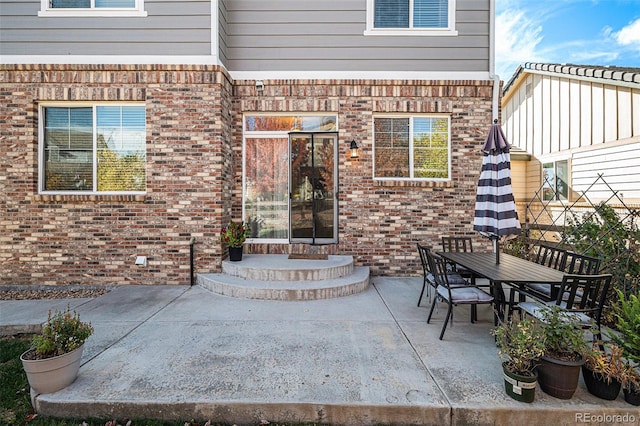 doorway to property featuring a patio