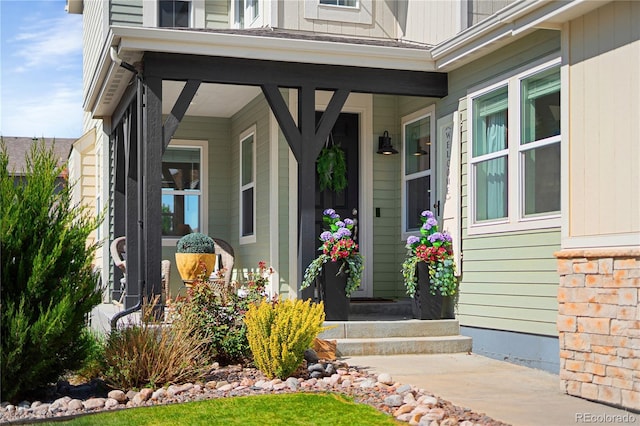 2855 Pawnee Creek Dr, Loveland, CO 80538 - doorway to property featuring covered porch