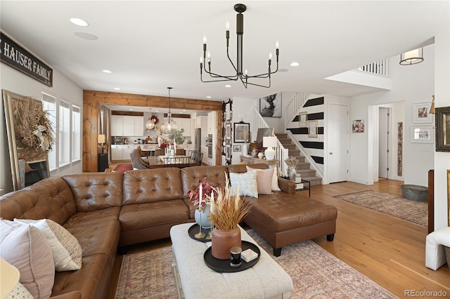 2855 Pawnee Creek Dr, Loveland, CO 80538 - living area with a chandelier, light wood-type flooring, stairway, and recessed lighting