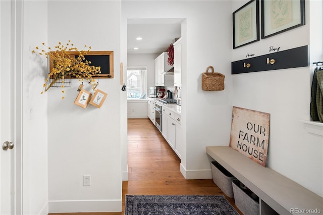 2855 Pawnee Creek Dr, Loveland, CO 80538 - hall with light wood-type flooring and recessed lighting