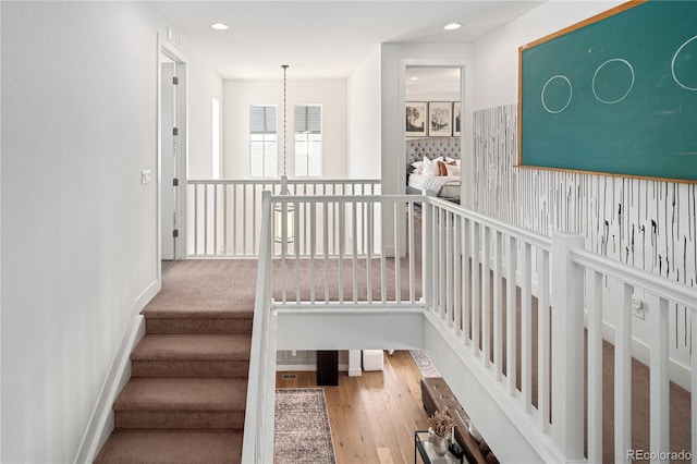 2855 Pawnee Creek Dr, Loveland, CO 80538 - stairway with wood finished floors and recessed lighting