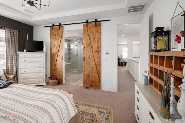 2855 Pawnee Creek Dr, Loveland, CO 80538 - bedroom featuring carpet, a barn door, and ensuite bath
