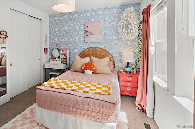 2855 Pawnee Creek Dr, Loveland, CO 80538 - carpeted bedroom with a closet and wallpapered walls