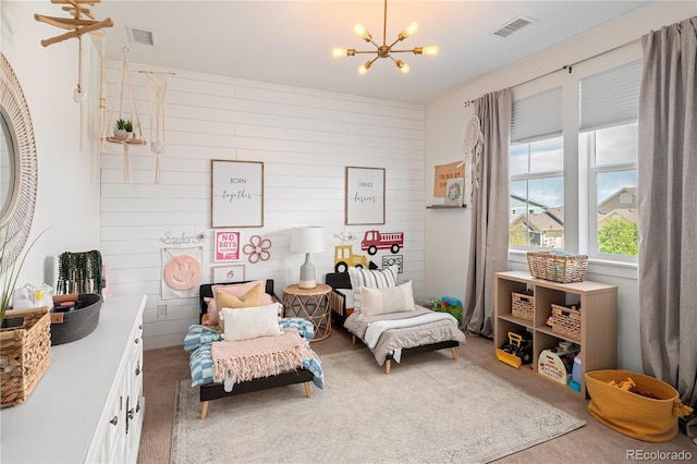2855 Pawnee Creek Dr, Loveland, CO 80538 - bedroom featuring a chandelier, carpet floors, and wooden walls