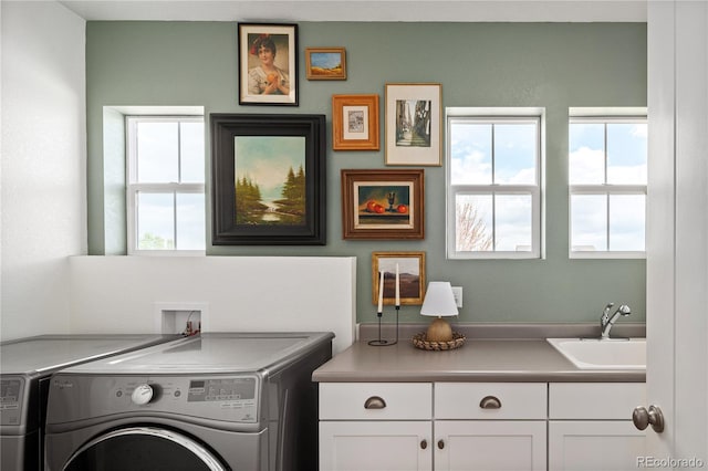 2855 Pawnee Creek Dr, Loveland, CO 80538 - laundry room with cabinet space and independent washer and dryer