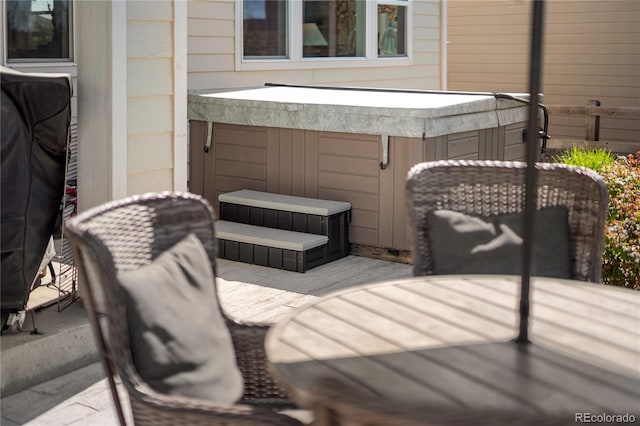 2855 Pawnee Creek Dr, Loveland, CO 80538 - view of patio featuring a hot tub