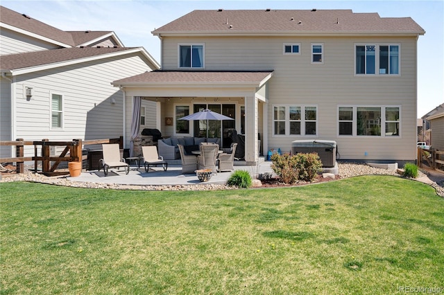 2855 Pawnee Creek Dr, Loveland, CO 80538 - rear view of property featuring a patio, a hot tub, and an outdoor living space