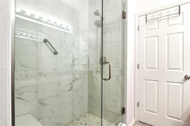 bathroom featuring a shower stall