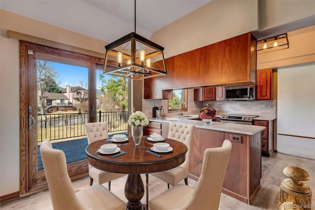 2631 Yorkshire St, Fort Collins, CO 80526 - dining space with light wood finished floors and a chandelier
