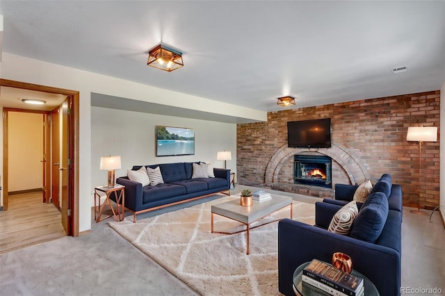 2631 Yorkshire St, Fort Collins, CO 80526 - living area featuring a fireplace, brick wall, and light colored carpet