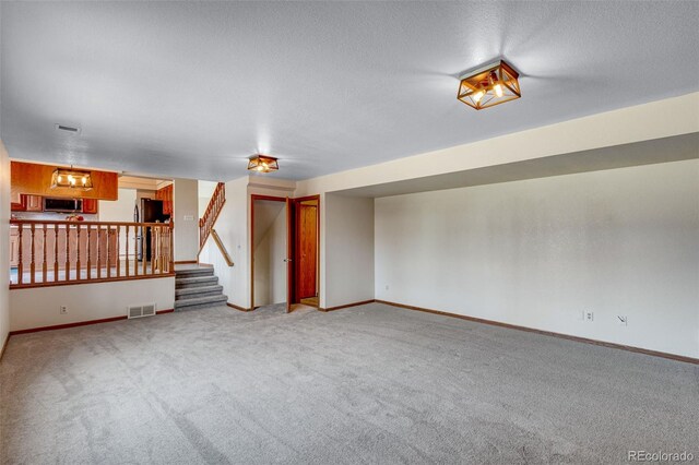 2631 Yorkshire St, Fort Collins, CO 80526 - empty room with carpet, a textured ceiling, and stairway