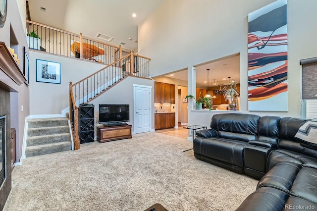 14179 Madison St, Thornton, CO 80602 - living room featuring stairway, a towering ceiling, carpet, a chandelier, and recessed lighting