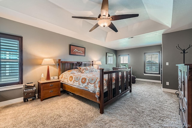 14179 Madison St, Thornton, CO 80602 - bedroom with light colored carpet, a raised ceiling, and ceiling fan