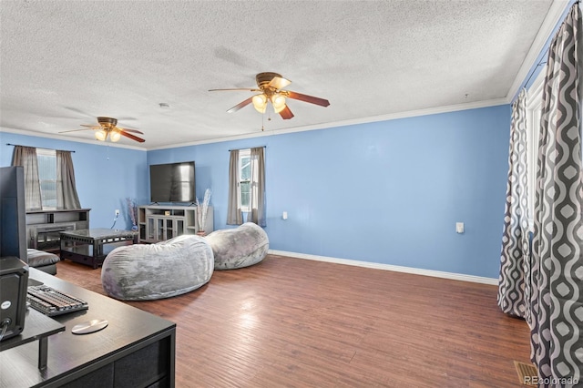 living room featuring crown molding, a healthy amount of sunlight, and dark hardwood / wood-style floors