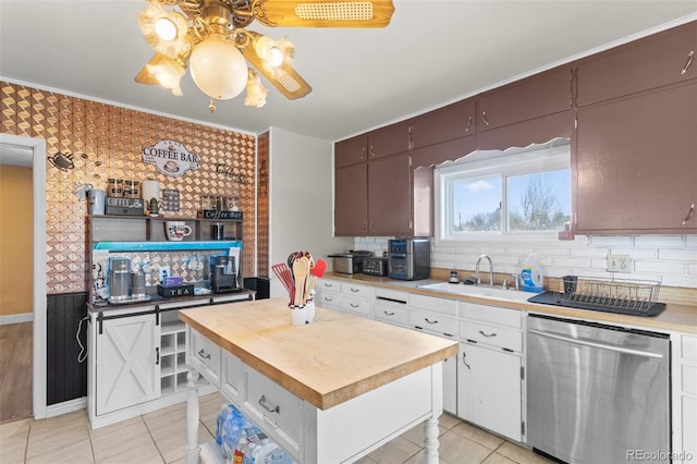 48 Elm St, Arriba, CO 80804 - kitchen with backsplash, stainless steel dishwasher, sink, and white cabinets