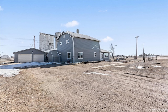 48 Elm St, Arriba, CO 80804 - back of house featuring a garage and an outdoor structure