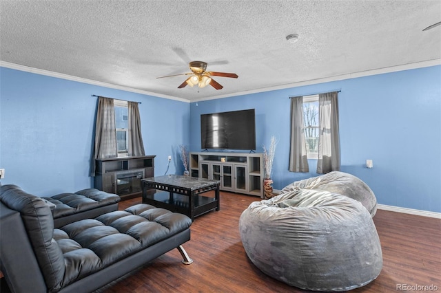 48 Elm St, Arriba, CO 80804 - living room featuring crown molding, ceiling fan, dark hardwood / wood-style floors, and a textured ceiling