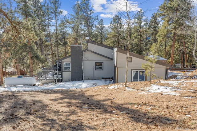 177 Gray St, Bailey, CO 80421 - snow covered property with a chimney