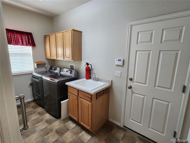 221 Homestead Pkwy, Longmont, CO 80504 - laundry area featuring washing machine and dryer and cabinet space