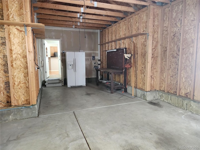 221 Homestead Pkwy, Longmont, CO 80504 - below grade area featuring white refrigerator with ice dispenser