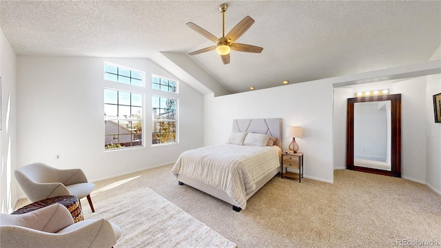 bedroom featuring light carpet, a textured ceiling, ceiling fan, and lofted ceiling