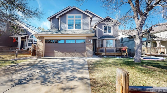 view of front of home featuring a garage and a front lawn