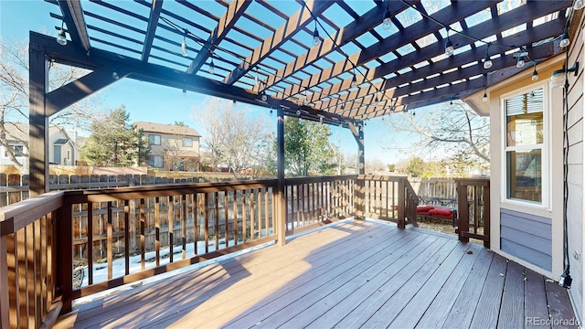 wooden deck featuring a pergola