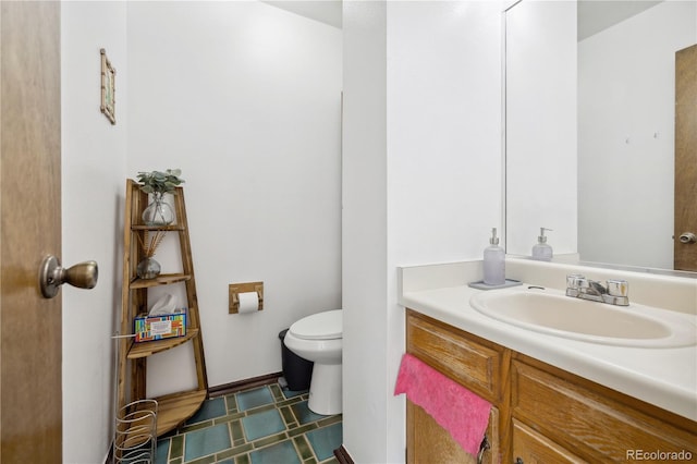 bathroom with vanity and toilet