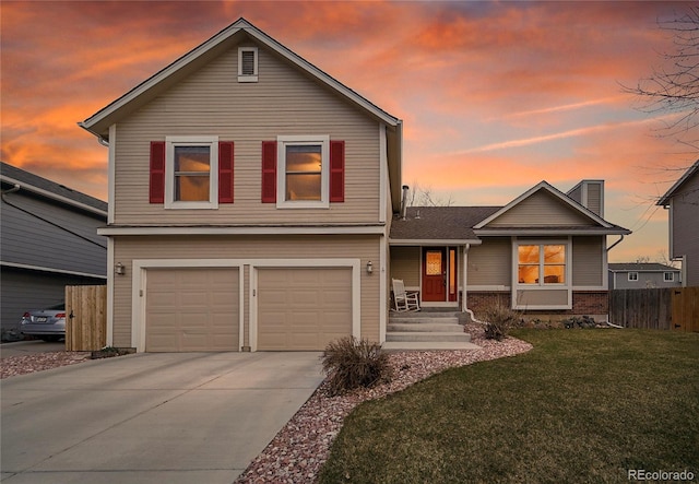 12028 W Aqueduct Dr, Littleton, CO 80127 - traditional-style home featuring concrete driveway, a front yard, fence, and an attached garage