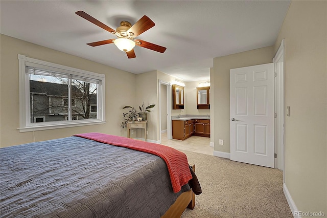 12028 W Aqueduct Dr, Littleton, CO 80127 - bedroom with baseboards, connected bathroom, ceiling fan, and light carpet