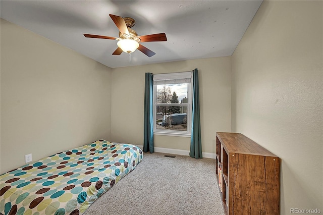 12028 W Aqueduct Dr, Littleton, CO 80127 - bedroom with visible vents, baseboards, a ceiling fan, and light colored carpet