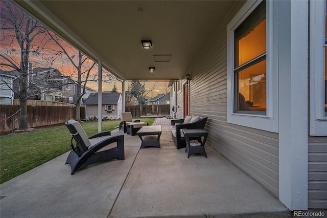 12028 W Aqueduct Dr, Littleton, CO 80127 - view of patio featuring a fenced backyard, outdoor lounge area, an outdoor structure, and a storage unit
