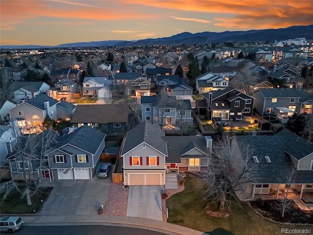 12028 W Aqueduct Dr, Littleton, CO 80127 - aerial view at dusk with a residential view and a mountain view
