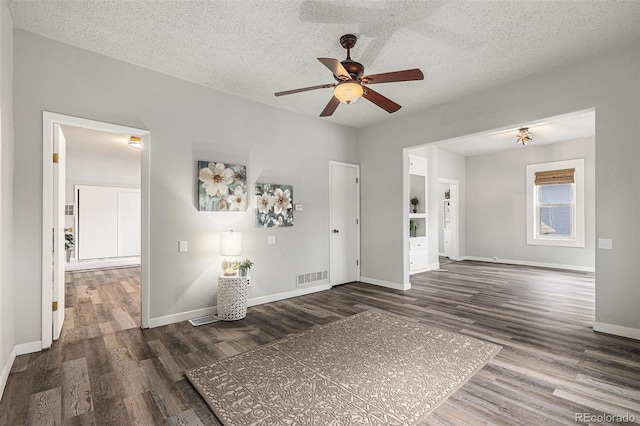 225 N Cedar St, Colorado Springs, CO 80903 - interior space with ceiling fan, dark wood finished floors, a textured ceiling, visible vents, and baseboards