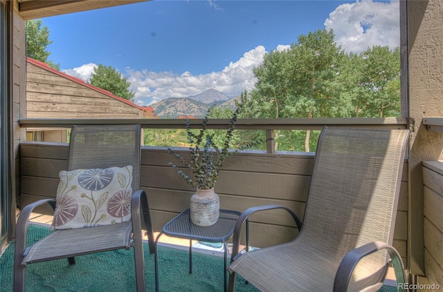 balcony featuring a mountain view